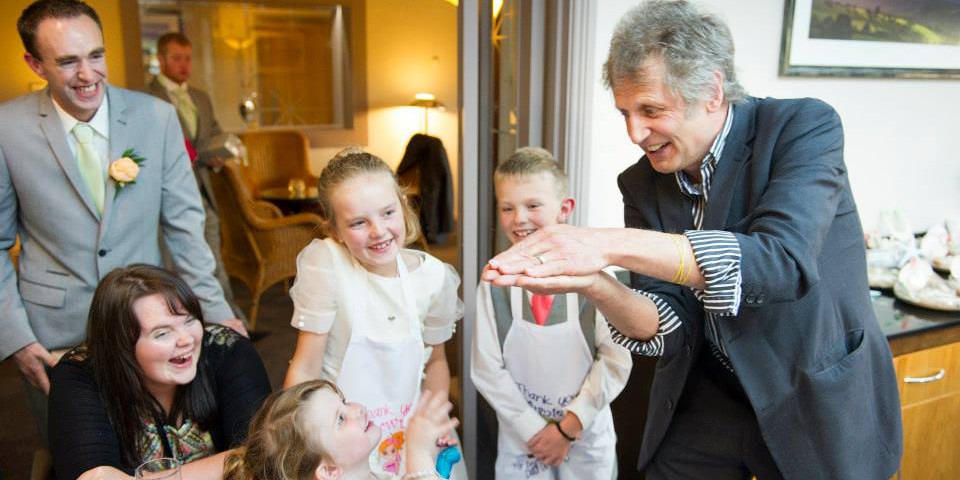 Luke performing magic at a wedding