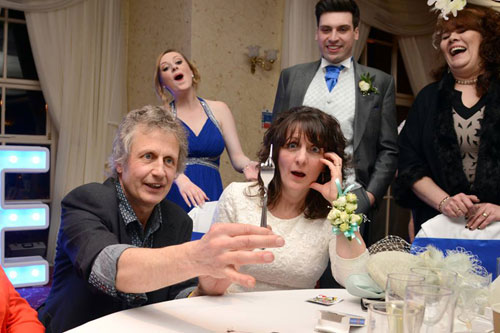 Wedding guest mesmorised by magician