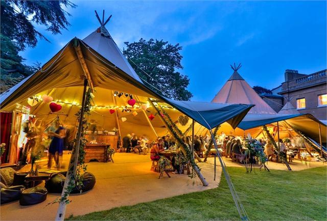 Beautiful wedding reception being held in a tipi.